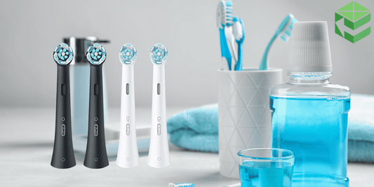 Oral-B iO Toothbrushes in black and white, in a modern bathroom.