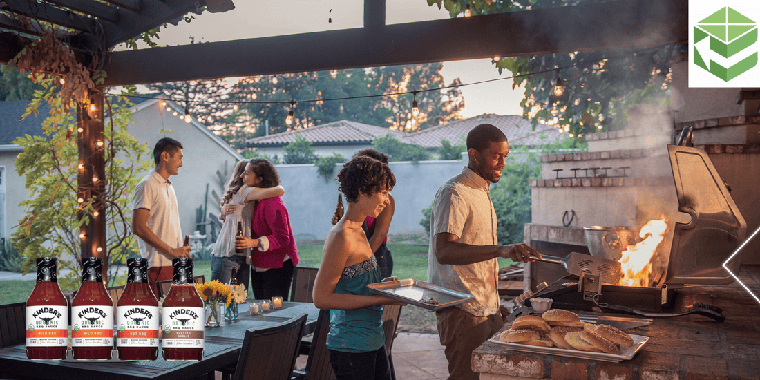 Backyard BBQ gathering with friends grilling burgers using Kinders BBQ Sauce, featuring a cozy evening ambiance.